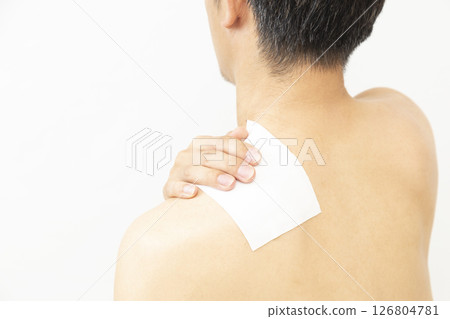 Back view of a man with a compress on white background 126804781