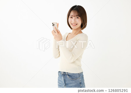 Woman holding a smartphone Woman holding a smartphone 126805291