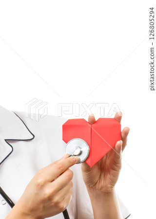 Hand of doctor with stethoscope examining red heart made of paper. Health care and treatment Hand of doctor with stethoscope examining red heart made of paper. Health care and treatment 126805294