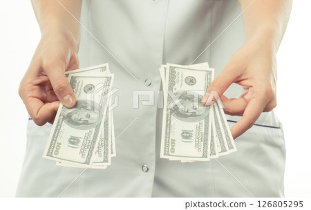 Doctor with dollars. Corruption, bribe or paying for health care or or examination 126805295