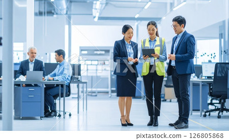 Japanese men and women working in a designer office 126805868