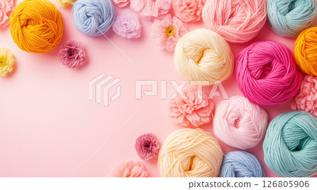 Colored yarn on a pink background. Skeins of wool yarn for knitting. Colored yarn on a pink background. Skeins of wool yarn for knitting. 126805906