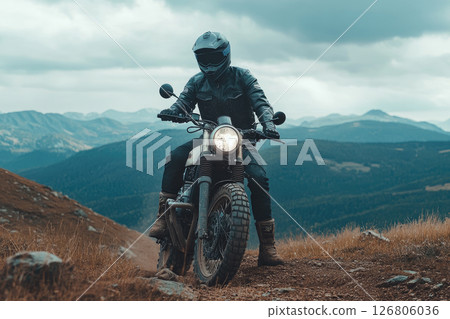 Extreme rider on a mountain top on off-road cross enduro motorcycle. 126806036