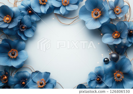 A festive card made from blue flowers with gold elements leaving blank space in the center for text. 126806530