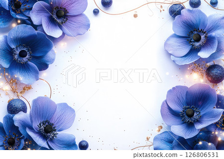 A festive card made from blue flowers with gold elements, copy space in the center for text. 126806531