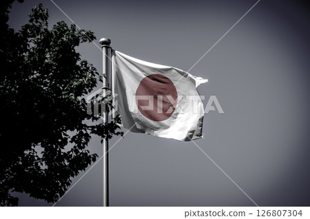As time passes, the Japanese flag is starting to show signs of wear and tear. Frayed systems, contradictions, and inadequacies. 126807304