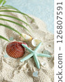 Starfish and shells washed up on a summer beach 126807591