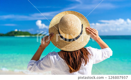 Okinawa ocean and the back of a woman in a straw hat Okinawa ocean and the back of a woman in a straw hat 126807937