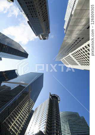 Low-angle building view of the modern office skyscrapers in the financial district of Raffles Place, Singapore. 126809305