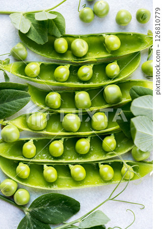 Fresh green peas beans in pods, white background, macro photo 126810779
