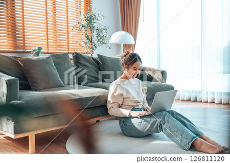Young Asian beautiful woman relaxing on comfortable couch Young Asian beautiful woman relaxing on comfortable couch 126811120