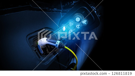 Power cable pump plug in charging power to electric vehicle EV car. 126811819