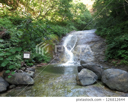 The first waterfall at Kamuiwakka Hot Springs in Shiretoko The first waterfall at Kamuiwakka Hot Springs in Shiretoko 126812644