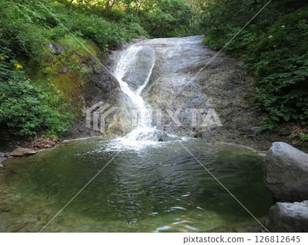 The first waterfall at Kamuiwakka Hot Springs in Shiretoko The first waterfall at Kamuiwakka Hot Springs in Shiretoko 126812645