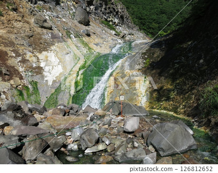 Four waterfalls (Yonnotaki) at Kamuiwakka Hot Springs in Shiretoko Four waterfalls (Yonnotaki) at Kamuiwakka Hot Springs in Shiretoko 126812652