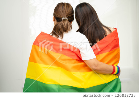 Asian couple woman with LGBT rainbow flag. 126812723