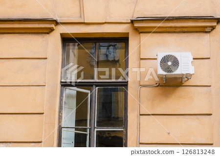 Air conditioning on facade of building and windows in the southern hot country. 126813248