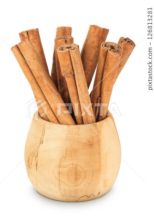 Cinnamon sticks in wooden bowl isolated on white background with full depth of field Cinnamon sticks in wooden bowl isolated on white background with full depth of field 126813281