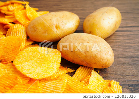 Potato chips , delicious BBQ seasoning spicy for crips, thin slice deep fried snack fast food. Potato chips , delicious BBQ seasoning spicy for crips, thin slice deep fried snack fast food. 126813326