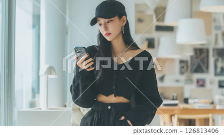 A young woman using a smartphone A young woman using a smartphone 126813406