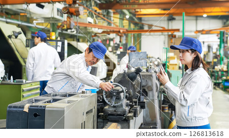 Group of workers working in a factory 126813618