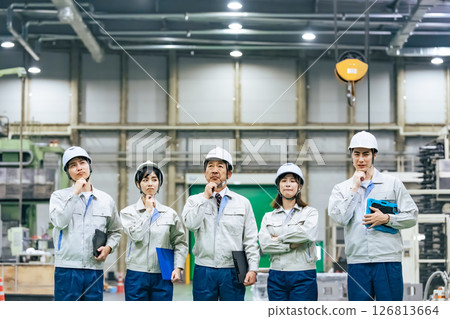 Group of workers thinking in a factory 126813664