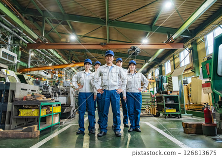 Group of workers standing in a factory 126813675