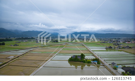Rice planting has begun on the Kurobe River alluvial fan in Nyuzen Town, Toyama Prefecture 126813745