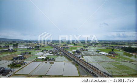 Rice planting has begun on the Kurobe River alluvial fan in Nyuzen Town, Toyama Prefecture 126813750