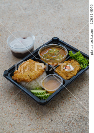 Thai Bento Box with Fried Pork Cutlet, Curry, and Traditional Dessert 126814046