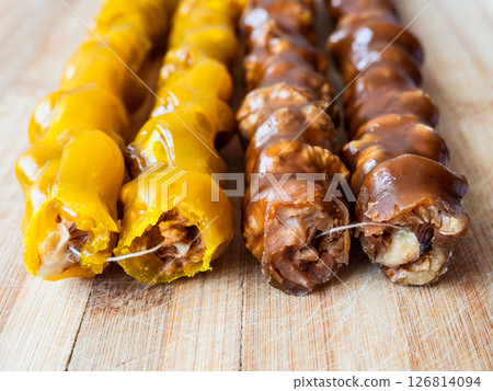 Armenian sweet sujukh close up on wooden board 126814094
