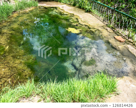 puddle with mineral water on path to Vorotan River 126814426