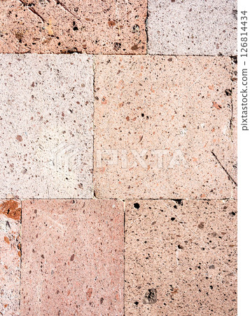 surface of wall tile from pink armenian tuff stone surface of wall tile from pink armenian tuff stone 126814434