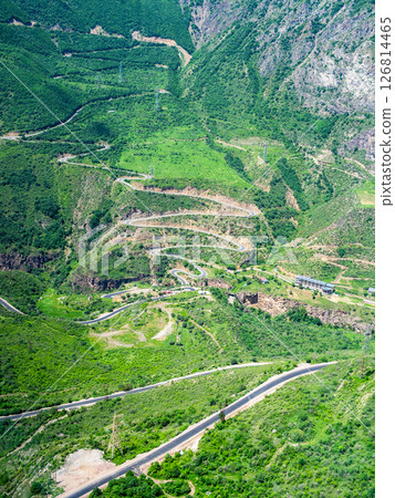 top view of mountain valley with serpentine road 126814465