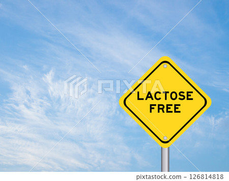 Yellow transportation sign with word lactose free on blue color sky background Yellow transportation sign with word lactose free on blue color sky background 126814818
