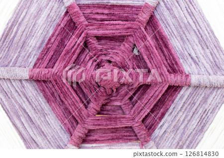 Closed up of violet color hexagon shape of weave textured background with copy space Closed up of violet color hexagon shape of weave textured background with copy space 126814830