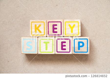 Alphabet letter block in word key step on wood background 126814832