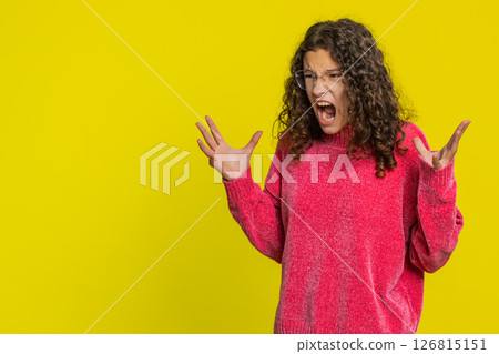 Irritated angry teenager child girl screams from stress tension problems shock rage nervous quarrel 126815151