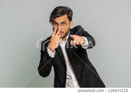 Business man pointing at her eyes camera show I am watching you gesture spying watching on someone 126815228