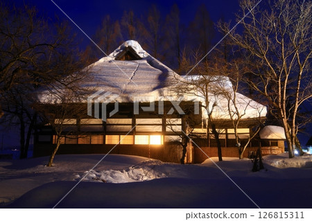 Snow-covered old house and snow igloos 126815311