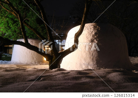 Snow-covered old house and snow igloos 126815314