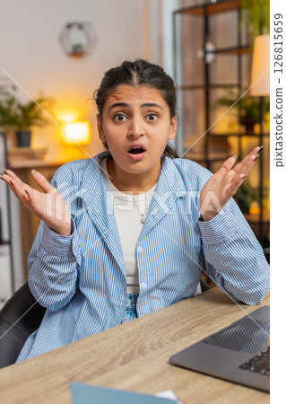 Stress young woman dissatisfied looking at camera shake head no rejection deny at table at home Stress young woman dissatisfied looking at camera shake head no rejection deny at table at home 126815659