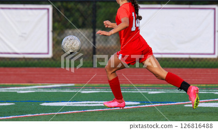 Soccer Player Makes a Swift Move on the Field During a Match Soccer Player Makes a Swift Move on the Field During a Match 126816488