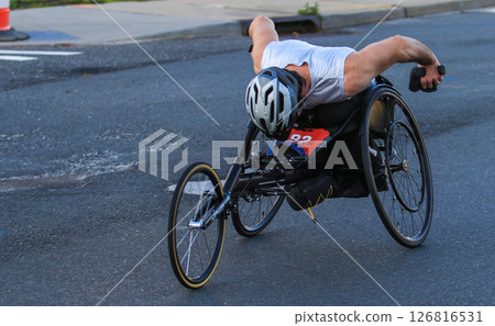 Competitive Athlete Using Handcycle During a Race on City Streets 126816531