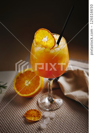 Close-up of vibrant orange cocktail  126816650