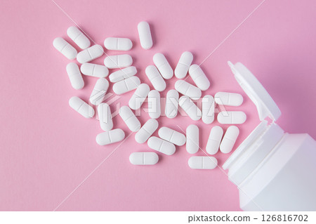 Much medical pills and drugs in white package on the pink background. Healthcare concept. Space for text. Much medical pills and drugs in white package on the pink background. Healthcare concept. Space for text. 126816702