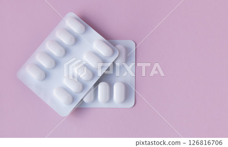 Much medical pills and drugs in white package on the pink background. Healthcare concept. Space for text. Much medical pills and drugs in white package on the pink background. Healthcare concept. Space for text. 126816706
