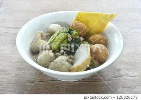 boiled fish ball with dumpling topping shrimp ball and morning glory in clear soup on bowl boiled fish ball with dumpling topping shrimp ball and morning glory in clear soup on bowl 126820178