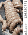 Close up of sausages production process at the meat factory. 126820771