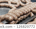 Close up of sausages production process at the meat factory. 126820772